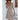 Woman wearing a beige floral boho maxi dress with puff sleeves and a high slit, posing with one hand on her waist.