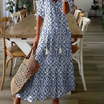 Sky blue floral chiffon maxi dress with V-neck and short sleeves, modeled in 3XL size.