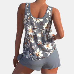 Floral gray women's athletic tank top featuring moisture-wicking fabric, designed with a sleeveless cut and a comfortable fit for active wear.