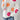 White floral knit sweater for women in XL size, featuring a cozy and vibrant design perfect for autumn and winter fashion. The sweater showcases intricate floral patterns with subtle hints of pink and red, offering a stylish and comfortable outerwear option.