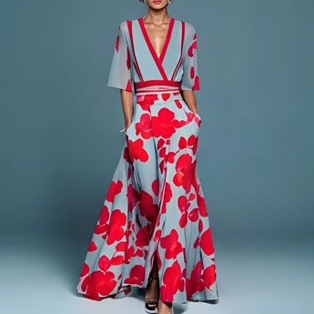Floral maxi dress featuring a red poppy print, designed with a V-neck, belted waist, and high slit, modeled by a fashion model.