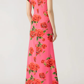 Pink floral mermaid dress featuring ruffles and a fitted design, perfect for garden parties. The gown has a one-piece structure with delicate shoulder sleeves and a flattering waistline, capturing a feminine and elegant look.