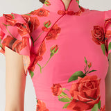 Pink floral mermaid dress with ruffled detailing, featuring a sleeveless design and fitted waist, perfect for garden parties.
