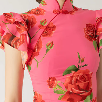 Pink floral mermaid dress with ruffled detailing, featuring a sleeveless design and fitted waist, perfect for garden parties.