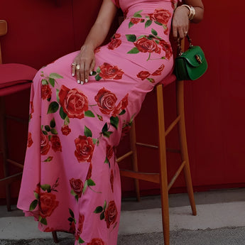Pink floral mermaid dress with ruffled details, featuring short sleeves and a fitted design, suitable for garden parties.