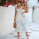 A floral midi dress with a pastel garden party print, showcasing a fitted waist and elegant short sleeves. The dress features a one-piece design with a delicate floral pattern, perfect for a summer vacation or daytime event.