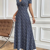Blue floral midi dress with short sleeves, fitted waist, and casual summer style.