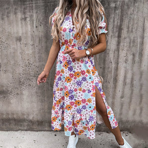 Multicolored floral midi dress with a high slit, featuring short sleeves and a fitted waist, styled as trendy summer streetwear in size 2XL.