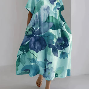 Floral oversized kaftan dress in blue, featuring watercolor design. The lightweight beachwear has a relaxed fit, suitable for size 5XL, with flowing sleeves, a comfortable neckline, and a loose collar, ideal for casual day wear.