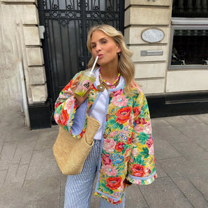 Floral pattern vintage bomber jacket featuring chic embroidered designs, showcasing a stylish collar, shoulder, and sleeve details.