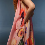 Elegant women's floral peach sleeveless jumpsuit, showcasing summer fashion with detailed view of the upper body and sleeveless design.