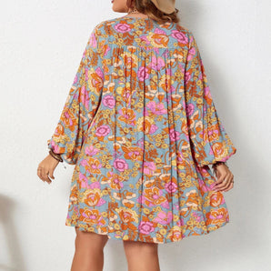 Woman wearing a floral print bohemian V-neck long sleeve mini dress in purple, suitable for fall and spring seasons.