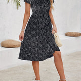 Floral print knee-length A-line cotton dress for women, showcasing spring fashion. The model is wearing the dress with visible footwear and a stylish hairstyle, highlighting the dress's shoulder and neckline design.