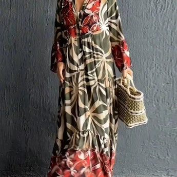 Multicolor floral print long sleeve button-front maxi dress modeled by a fashion model, showcasing the dress's joint, shoulder, neck, and waist details.