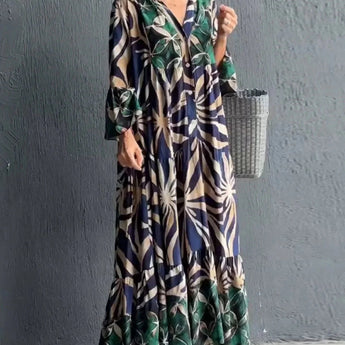 Floral print long sleeve button-front maxi dress with a casual chic style, featuring a fitted waist and elegant flow from neck to hem, ideal for daytime wear.