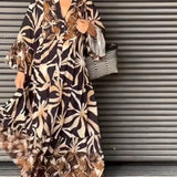 Floral print long sleeve button-front maxi dress showcasing a casual chic design with a focus on the waist, worn by a smiling woman.