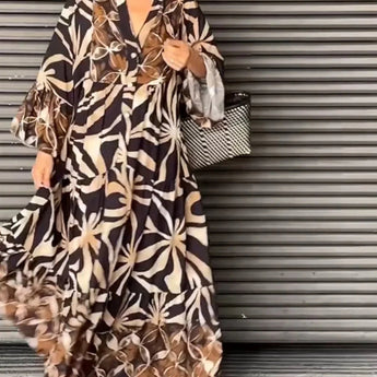 Floral print long sleeve button-front maxi dress showcasing a casual chic design with a focus on the waist, worn by a smiling woman.