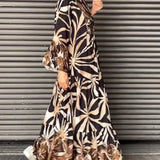 Floral print long sleeve button-front maxi dress in a casual chic style, featuring a camouflage-inspired design with a defined waist and elegant neckline, suitable for various occasions.