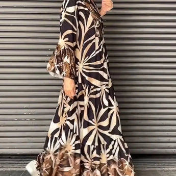 Floral print long sleeve button-front maxi dress in a casual chic style, featuring a camouflage-inspired design with a defined waist and elegant neckline, suitable for various occasions.