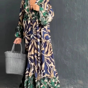 Floral print long sleeve button-front maxi dress featuring a casual chic design, with a focus on the neckline, waistline, and shoulder fit, modeled by a fashion model.