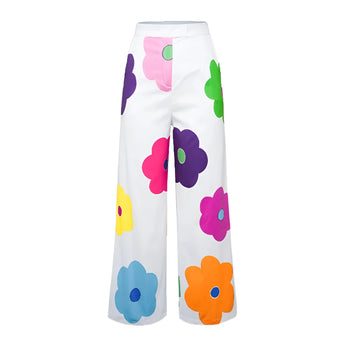 High-waisted women's summer trousers with a floral print pattern in shades of violet and magenta.