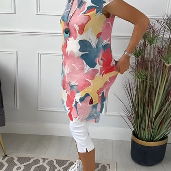 Floral print sleeveless summer tunic top for women featuring a white background, showcasing neck and shoulder details, worn by a standing model.