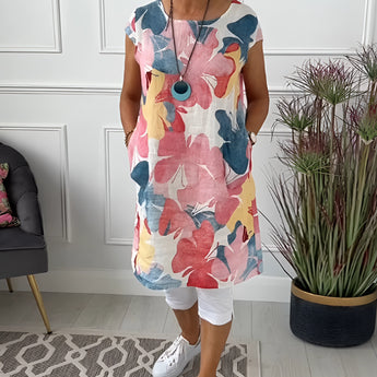 
A multicolor 3XL floral print sleeveless summer tunic top for women, showcasing vibrant flower patterns and a flowing design that falls to mid-thigh.