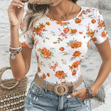 Women's Floral Print T-Shirt in White and Orange with Rose Pattern, XL size, featuring short sleeves and a round neck design.
