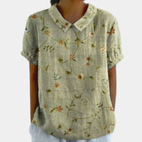 Floral print V-neck women's casual bohemian summer blouse in green with long sleeves and button details, styled in a relaxed fit for a comfortable and fashionable look.