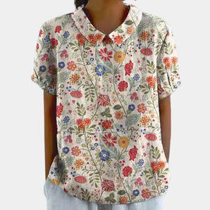 Floral print V-neck women's casual bohemian summer blouse in apricot with long sleeves and a relaxed fit, featuring a stylish and vibrant pattern.