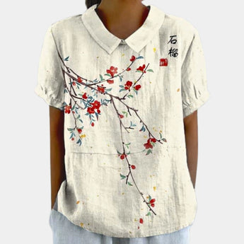 Floral print V-neck women's casual Bohemian summer blouse in white, size XL, featuring short sleeves and a loose fit.