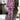
A purple and black floral print women's off-shoulder jumpsuit designed for luxury evening wear, featuring long sleeves and an elegant neckline in size XL.