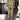 Floral print women's off-shoulder jumpsuit in yellow, featuring an elegant design suitable for luxury evening wear, highlighting a fitted waist and wide-leg pants in an XL size.