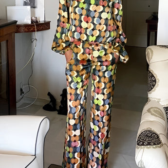 Floral print women's off-shoulder jumpsuit in yellow, featuring an elegant design suitable for luxury evening wear, highlighting a fitted waist and wide-leg pants in an XL size.