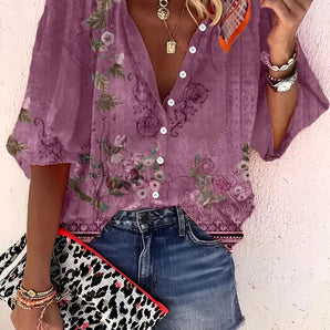 Purple boho chic floral sheer blouse with a V-neck and short sleeves, styled in a summer fashion.