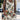 A beige floral sleeveless summer dress in size 2XL, featuring a botanical print and tropical leaf pattern, displayed on a mannequin.