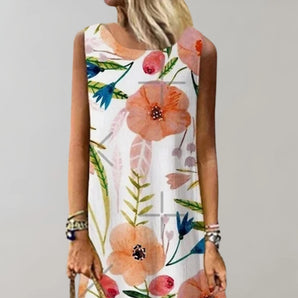Floral sleeveless summer dress featuring a light botanical print, showcasing a casual and breezy design with a fitted waist and a comfortable neckline.