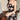 Elegant black strapless mini dress with floral patterns, showcasing a stylish party wear design.