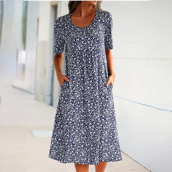 Blue floral summer dress for women, featuring short sleeves, a midi length, and a botanical print.