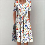 White botanical print floral summer dress for women, featuring short sleeves, a midi length, and a stylish design in a white and red color scheme, size 3XL.