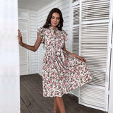 Floral summer midi dress with short sleeves and an A-line silhouette, featuring a tie waist.