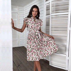 Floral summer midi dress with short sleeves and an A-line silhouette, featuring a tie waist.