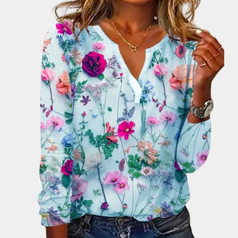 Blue floral V-neck blouse with long sleeves made from lightweight chiffon fabric in extra-large size.