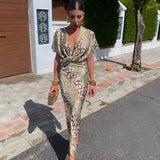 Olive green maxi dress with a floral pattern, featuring a V-neckline and puff sleeves, shown in size 4XL.