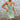 Woman wearing a green floral V-neck sleeveless mini sundress, ideal for spring fashion, in size XL.