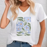 Floral V-neck women's T-shirt in dark green, featuring a white design with eco-friendly fabric, displayed on a mannequin showcasing the neckline and fashion details.