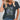 Dark gray floral V-neck women's T-shirt in size 3XL, featuring eco-friendly materials with a green and white plant pattern on the front.