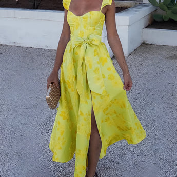 Yellow floral vintage summer dress with sleeves in XL size, featuring a pastel blue and yellow floral pattern. The dress is a one-piece garment with a defined waist and thigh-length design.