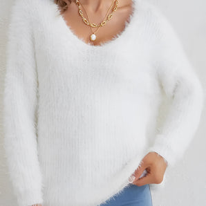 A soft, cozy, fluffy white V-neck sweater with long sleeves, perfect for winter wear.