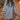 Forest green oversized cable knit sweater dress featuring a cozy turtleneck design. The dress has long sleeves and an ample fit, extending to the knees, highlighting a casual and comfortable style.